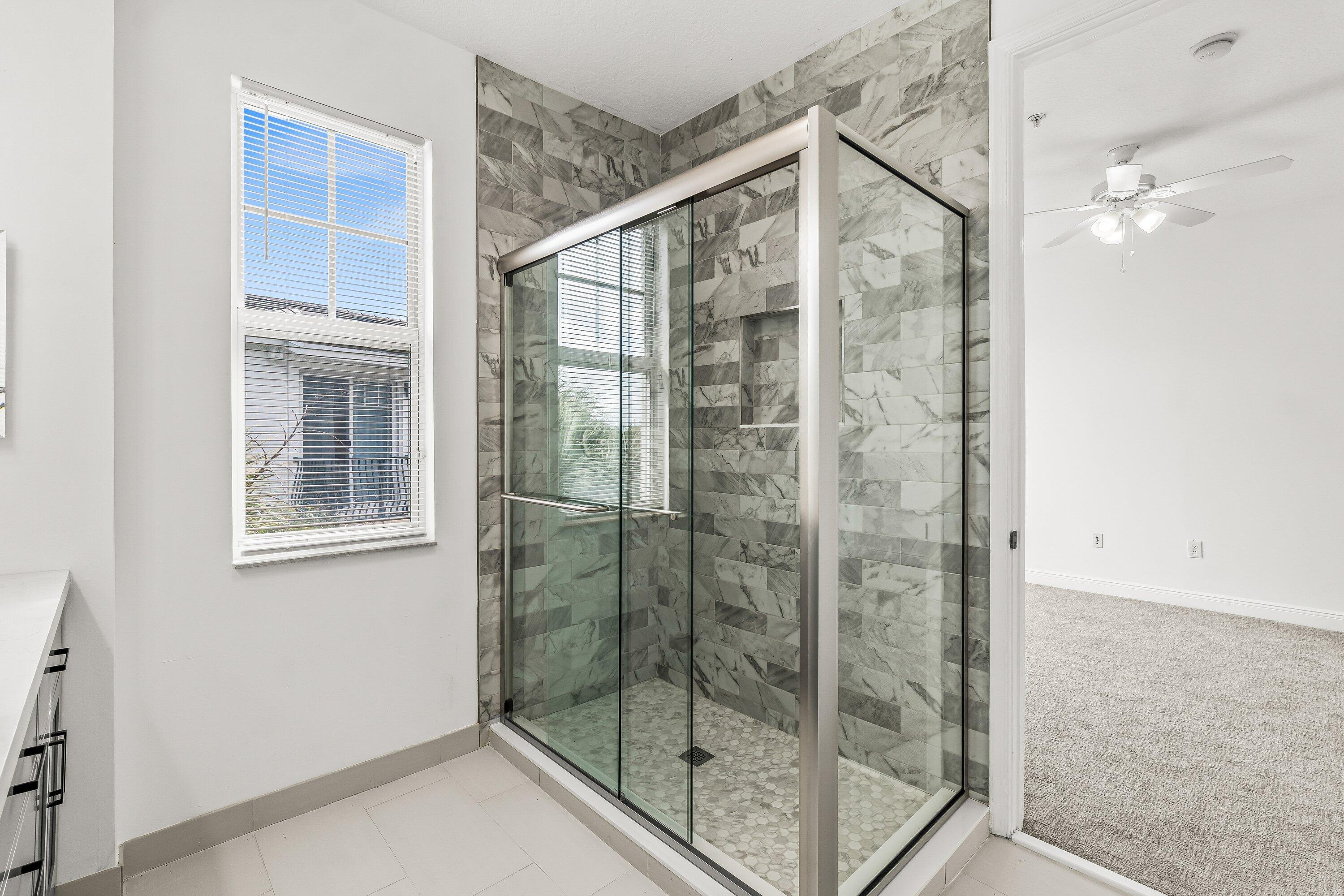 3830 Northwest 5th Terrace Boca Raton, FL 33431 - Photo 28 of 30 a bathroom with a glass shower door