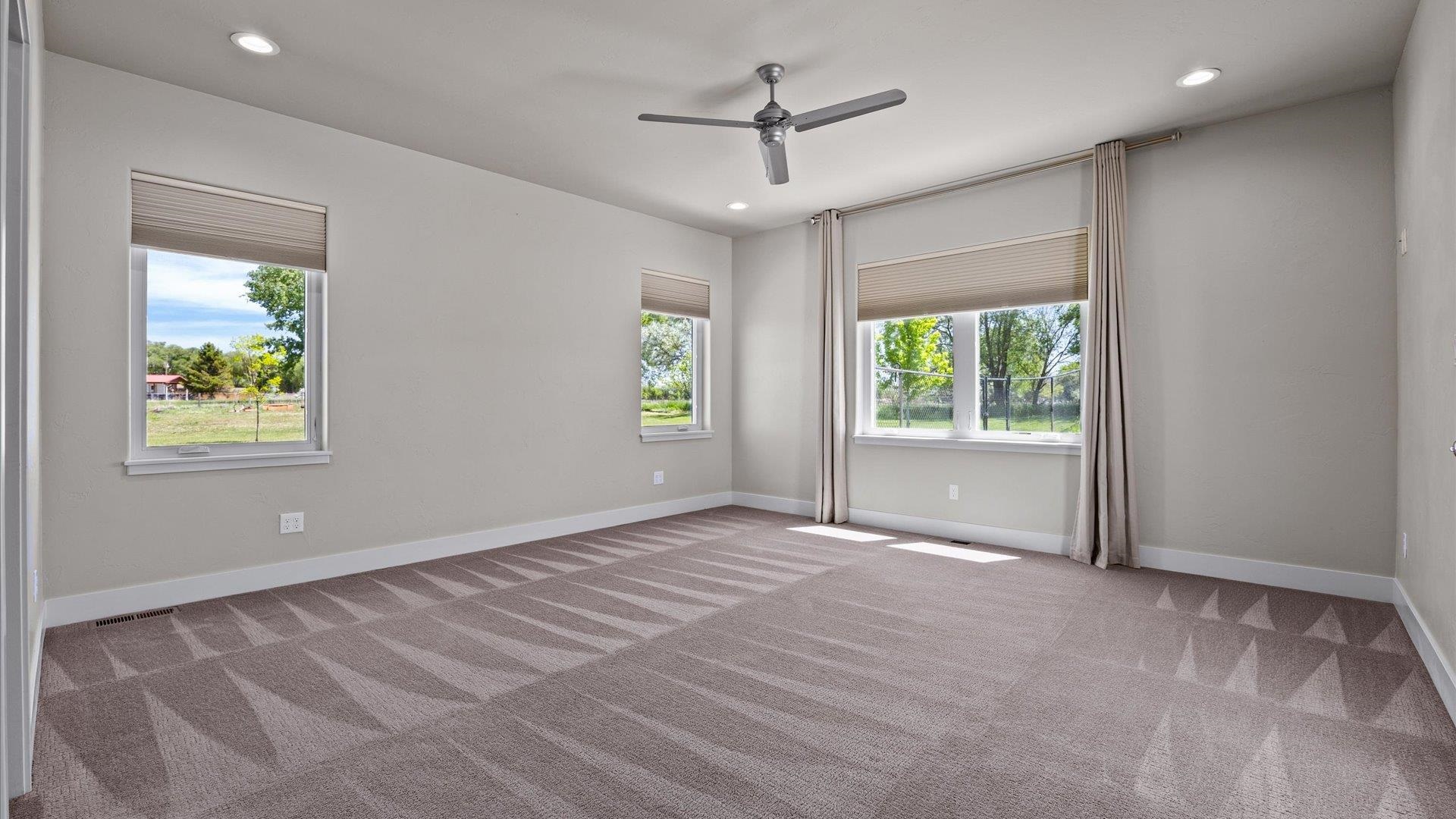 2041 J J 1/2 Road Fruita, CO 81521 - Photo 14 of 42 a view of an empty room with a window