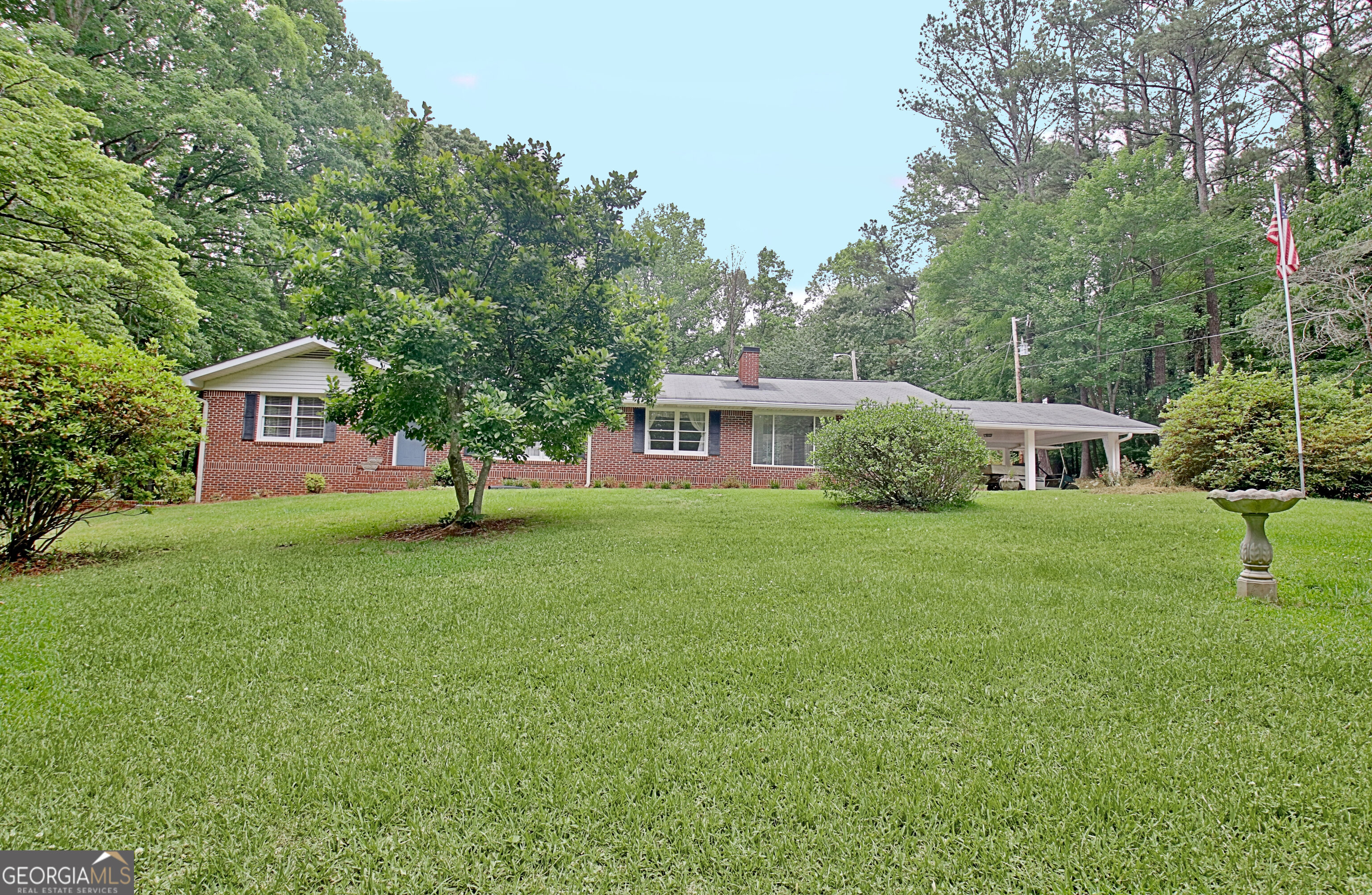 717 Tyrone Road Tyrone, GA 30290 - Photo 1 of 58 a front view of a house with garden