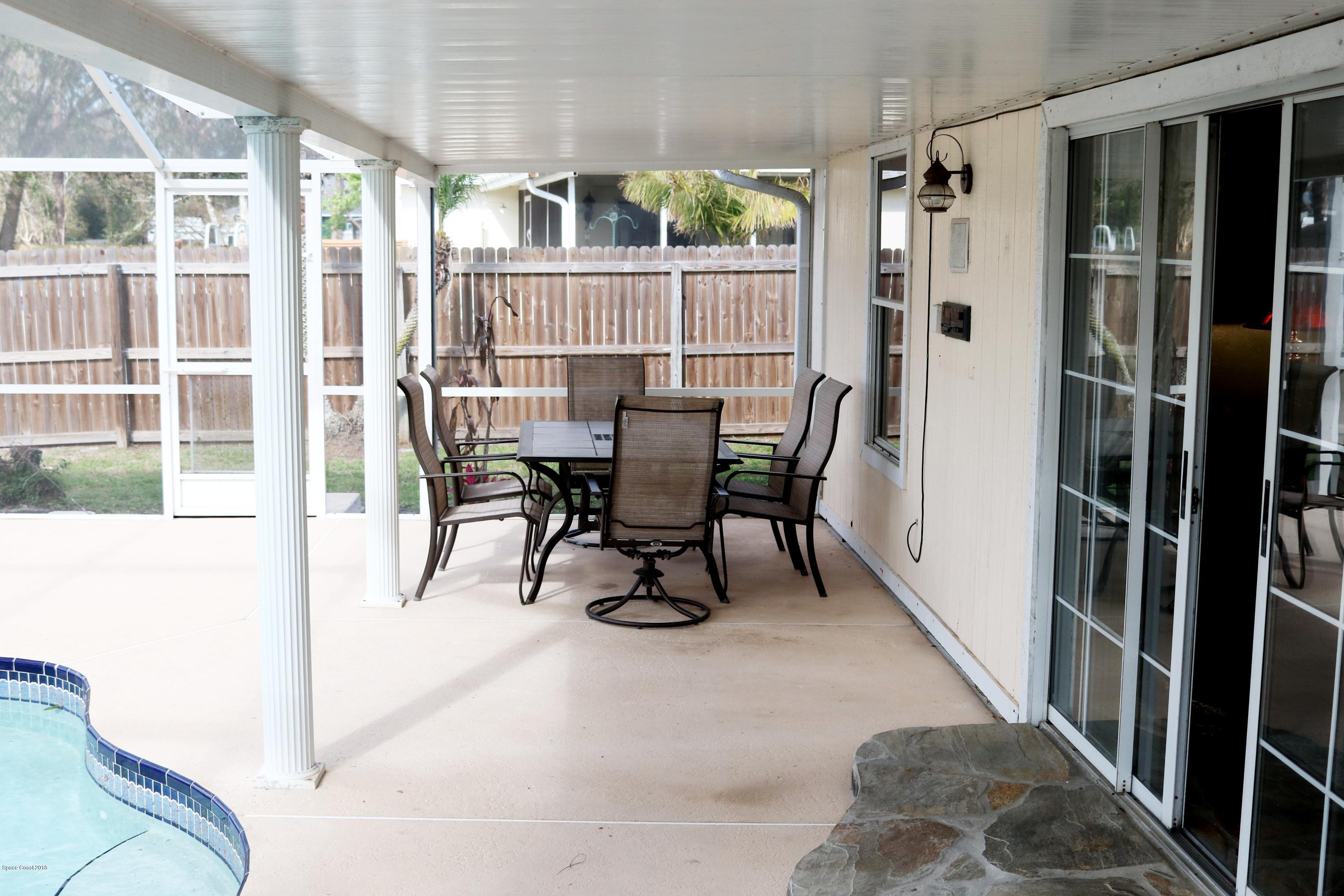 6154 Corning Road Cocoa, FL 32927 - Photo 11 of 16 a view of a dining room with furniture window and outside view