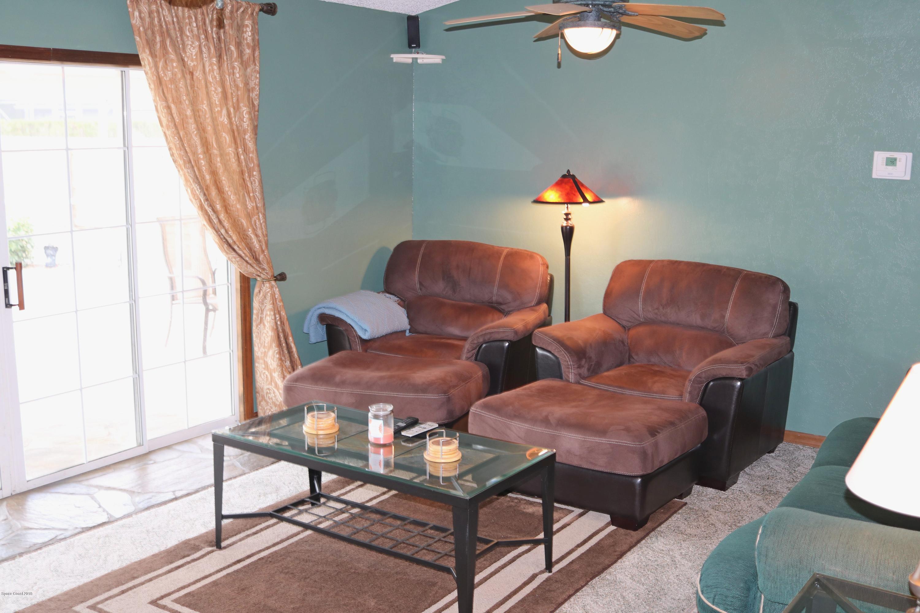 6154 Corning Road Cocoa, FL 32927 - Photo 4 of 16 a living room with furniture and a window