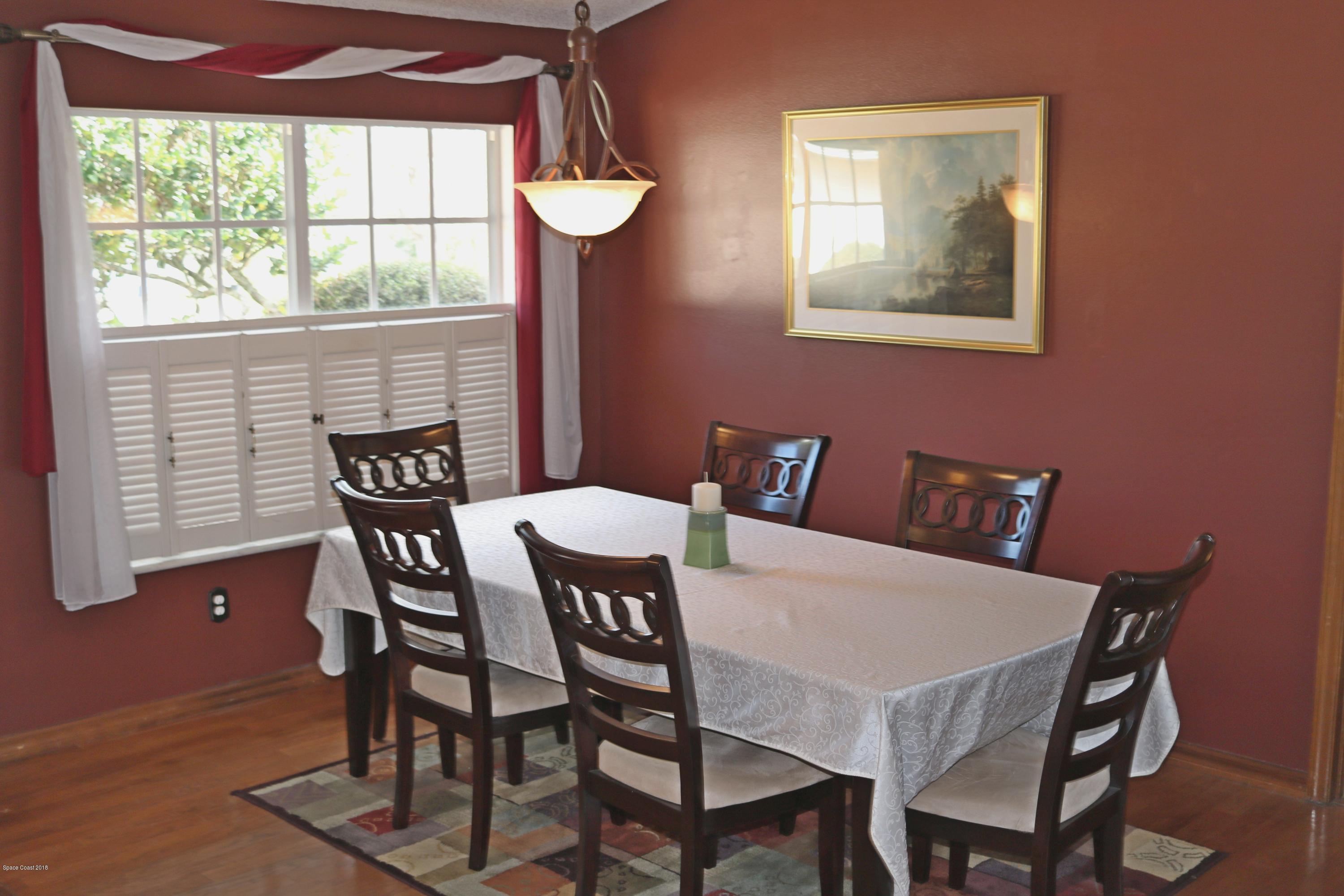 6154 Corning Road Cocoa, FL 32927 - Photo 6 of 16 a view of a dining room with furniture and window