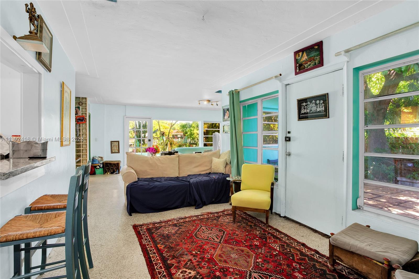 1541 Calais Drive Miami Beach, FL 33141 - Photo 13 of 33 a living room with furniture and a rug