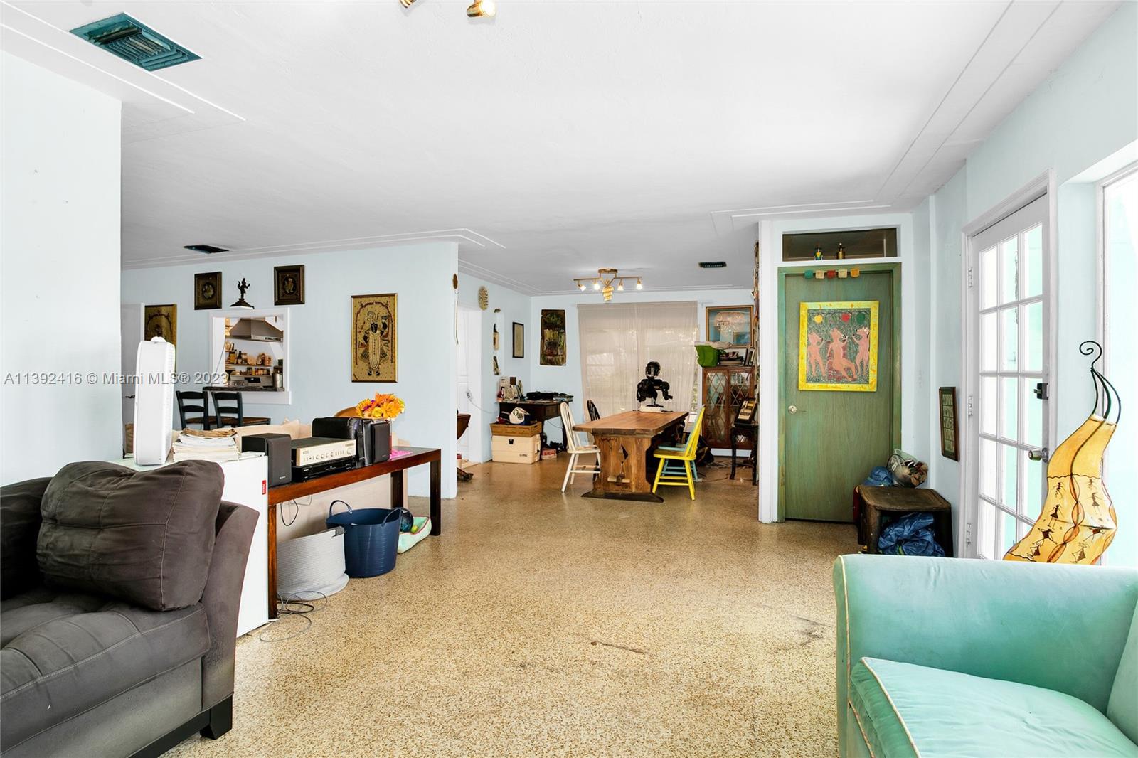 1541 Calais Drive Miami Beach, FL 33141 - Photo 14 of 33 a living room with furniture and a large window