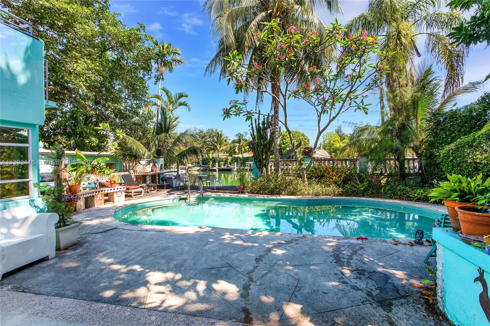 1541 Calais Drive Miami Beach, FL 33141 - Photo 21 of 33 a view of a yard with plants and trees