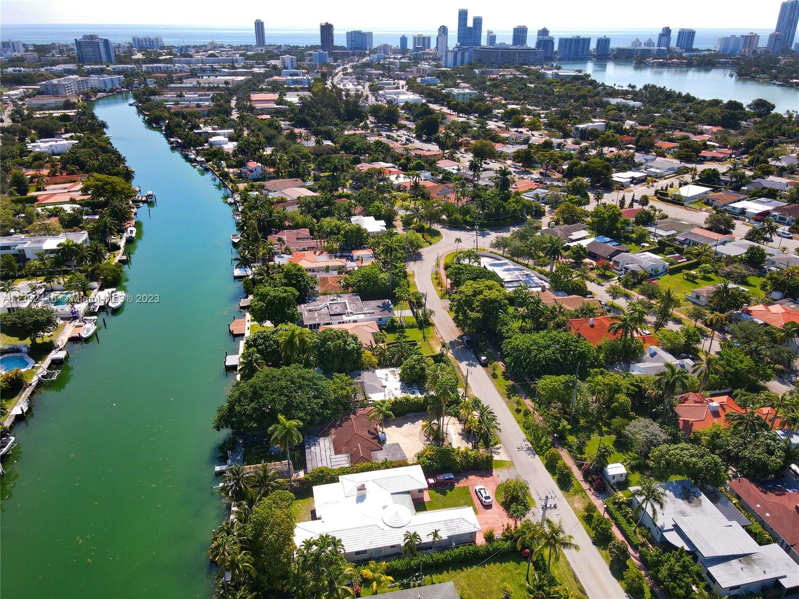 1541 Calais Drive Miami Beach, FL 33141 - Photo 24 of 33 an aerial view of residential houses with outdoor space and lake view