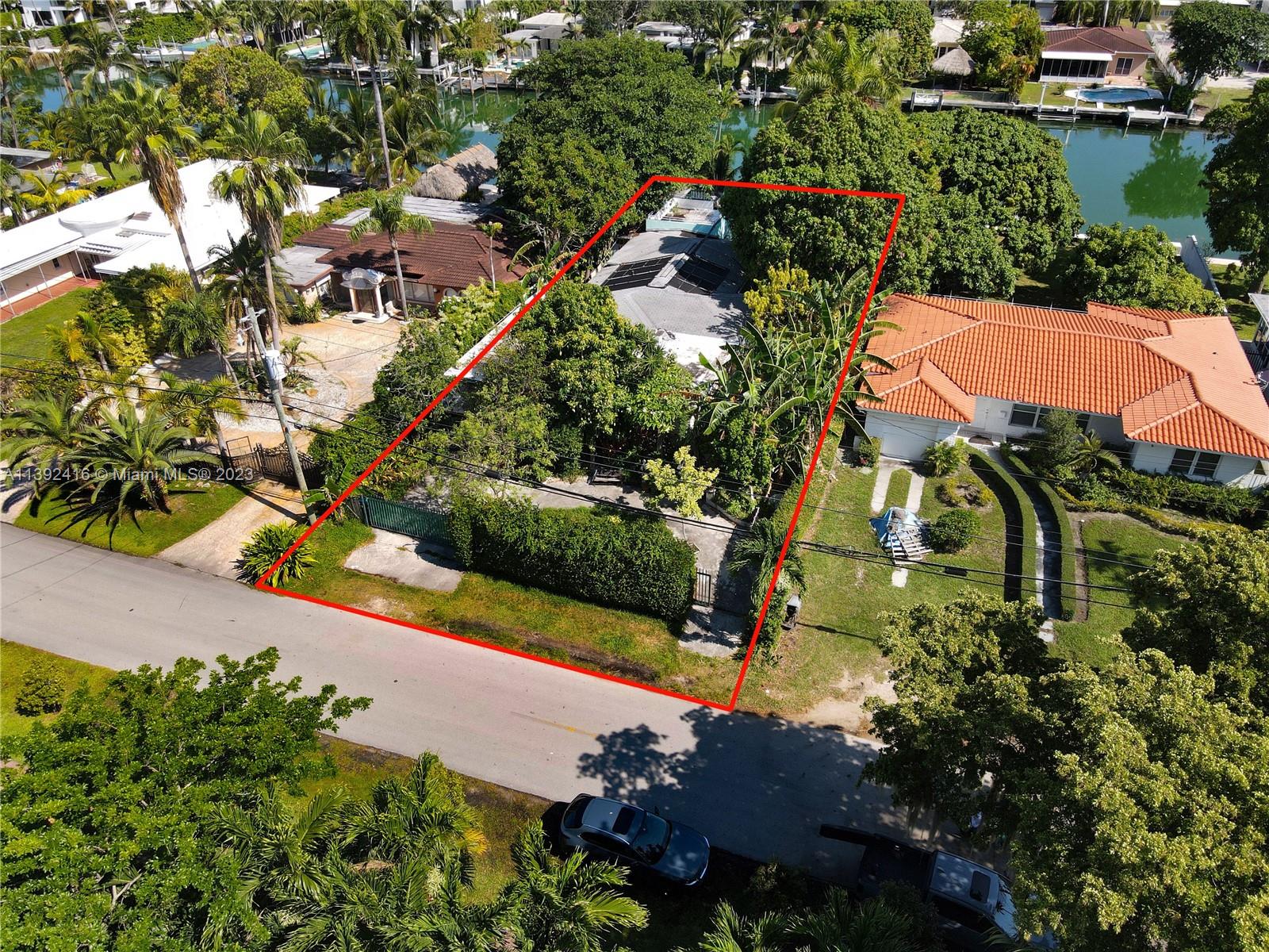 1541 Calais Drive Miami Beach, FL 33141 - Photo 27 of 33 an aerial view of residential house with outdoor space and a lake view