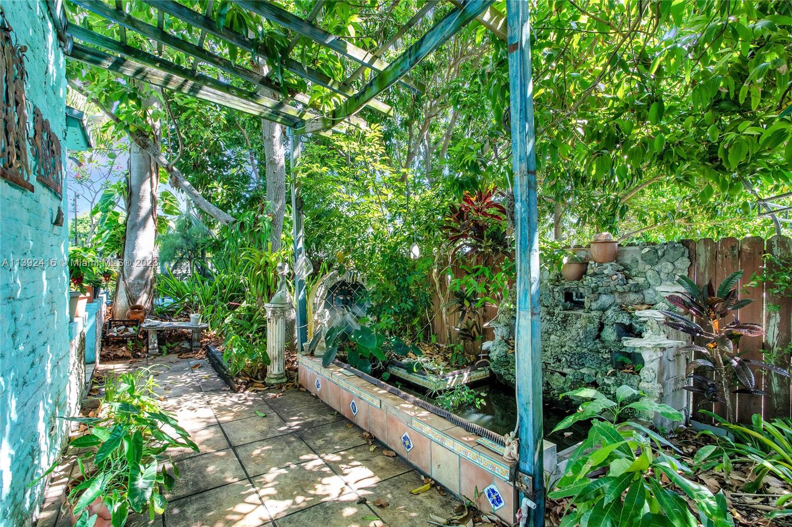 1541 Calais Drive Miami Beach, FL 33141 - Photo 30 of 33 a view of a garden with plants