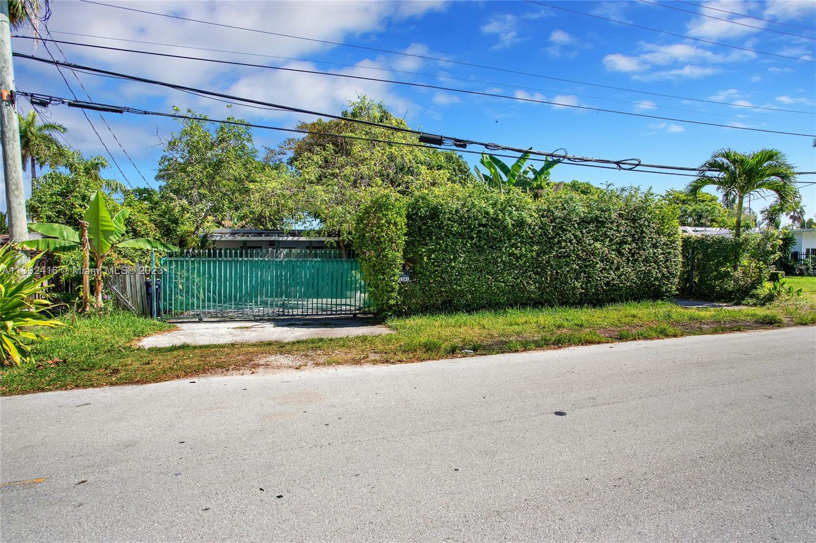 1541 Calais Drive Miami Beach, FL 33141 - Photo 32 of 33 a view of a yard with potted plants