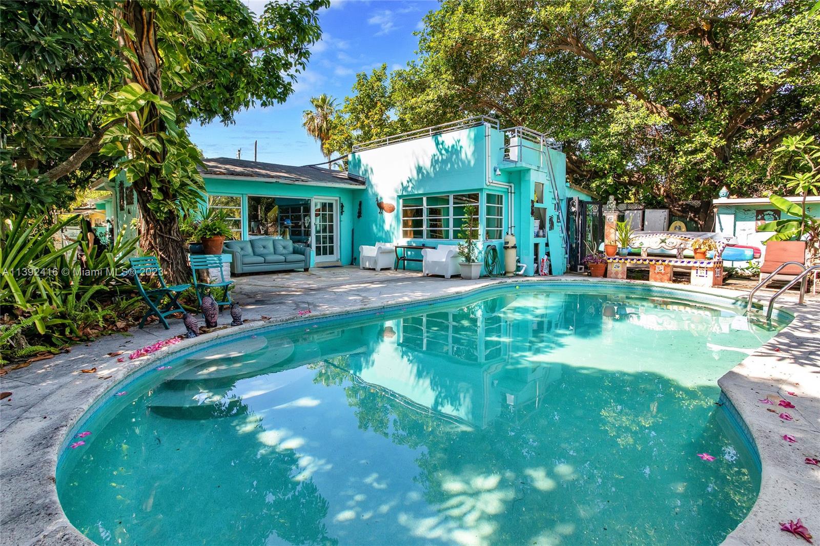 1541 Calais Drive Miami Beach, FL 33141 - Photo 6 of 33 a view of a house with a garden