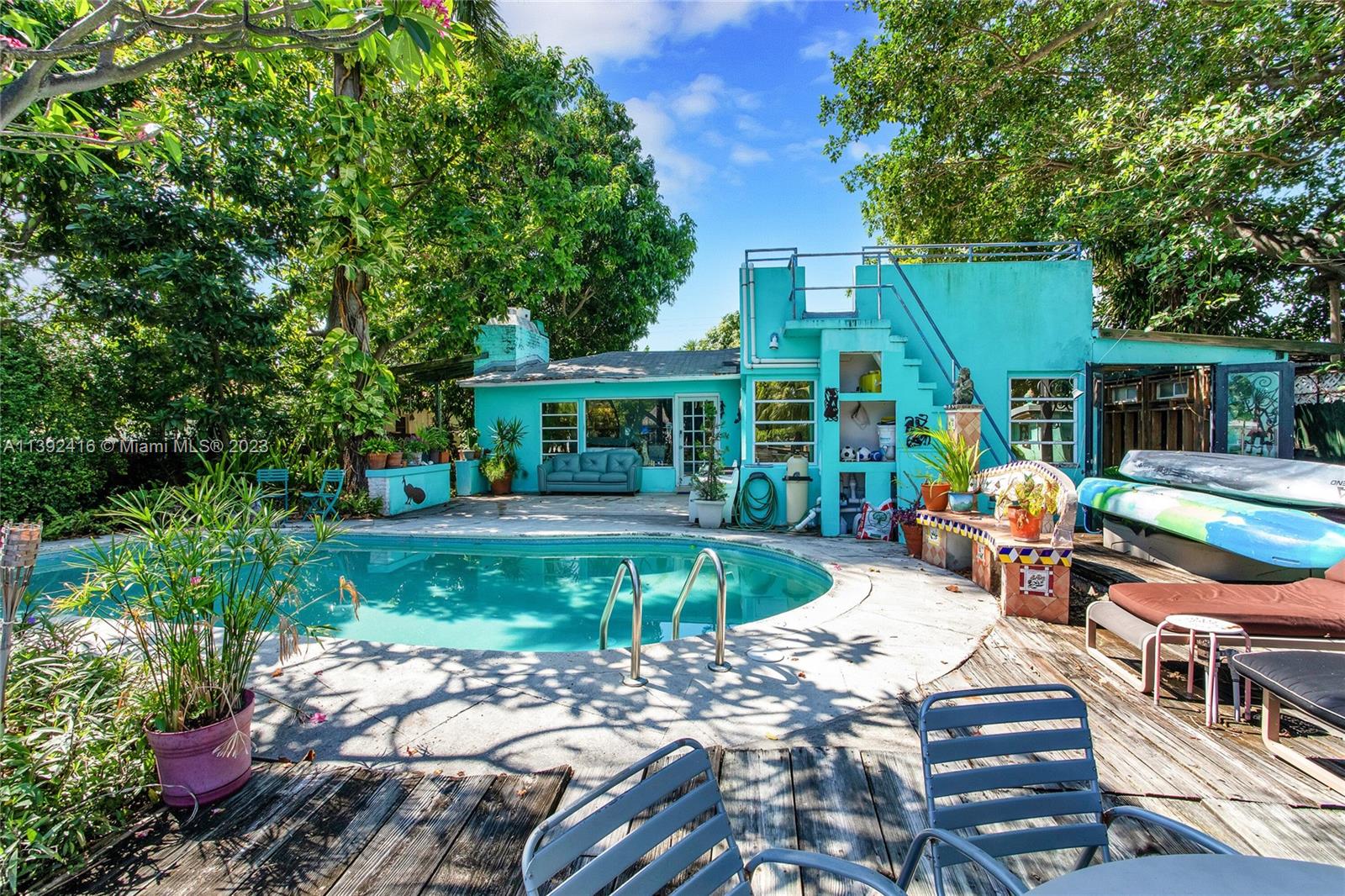 1541 Calais Drive Miami Beach, FL 33141 - Photo 7 of 33 a view of a house with backyard sitting area and garden