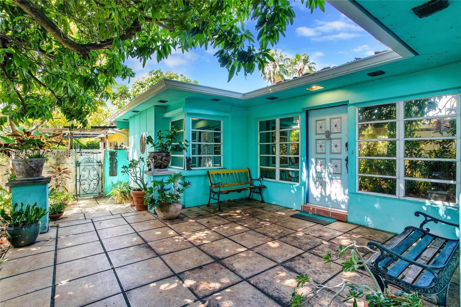 1541 Calais Drive Miami Beach, FL 33141 - Photo 8 of 33 a front view of a house with a porch
