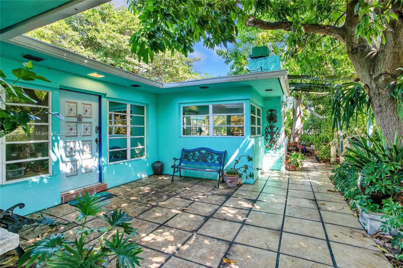 1541 Calais Drive Miami Beach, FL 33141 - Photo 9 of 33 a view of a house with a porch