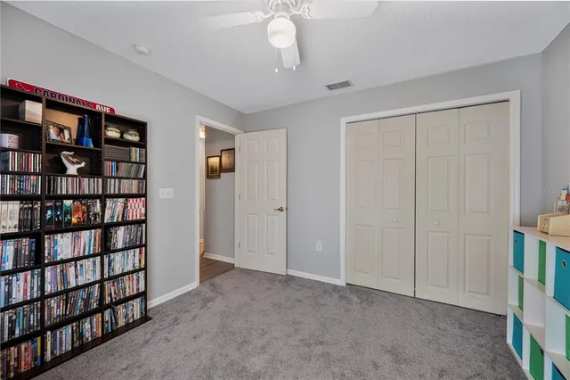 a view of livingroom with furniture and cabinet