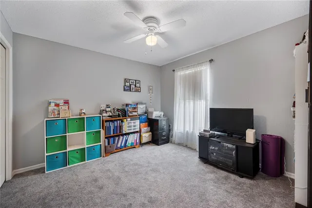 a room with furniture and a flat screen tv