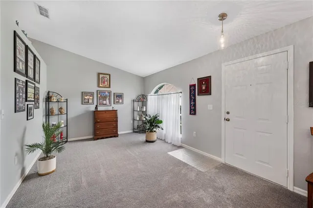 a view of livingroom with furniture and ceiling fan