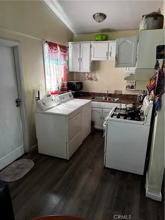 a kitchen with a stove and a refrigerator