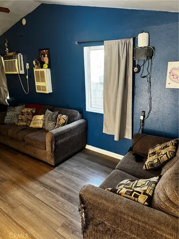 a living room with furniture and window
