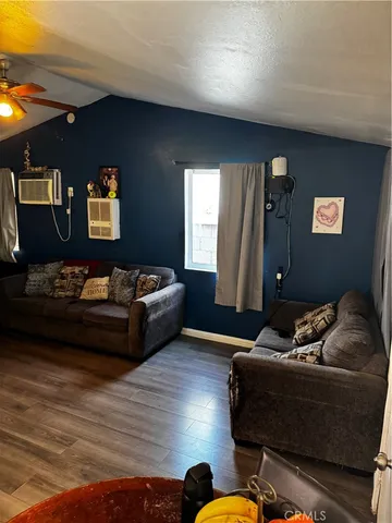 a living room with furniture and window