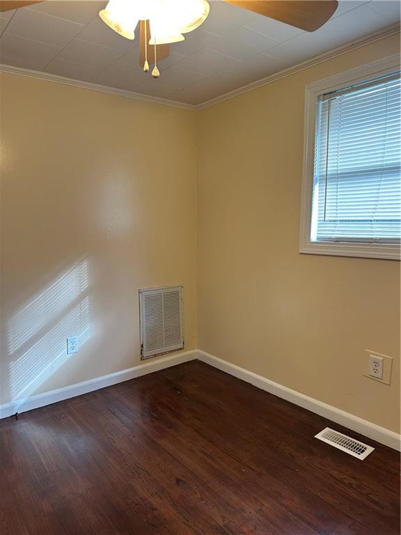 615 Cassville Road Southeast, Unit A Cartersville, GA 30120 - Photo 18 of 21 an empty room with wooden floor and windows