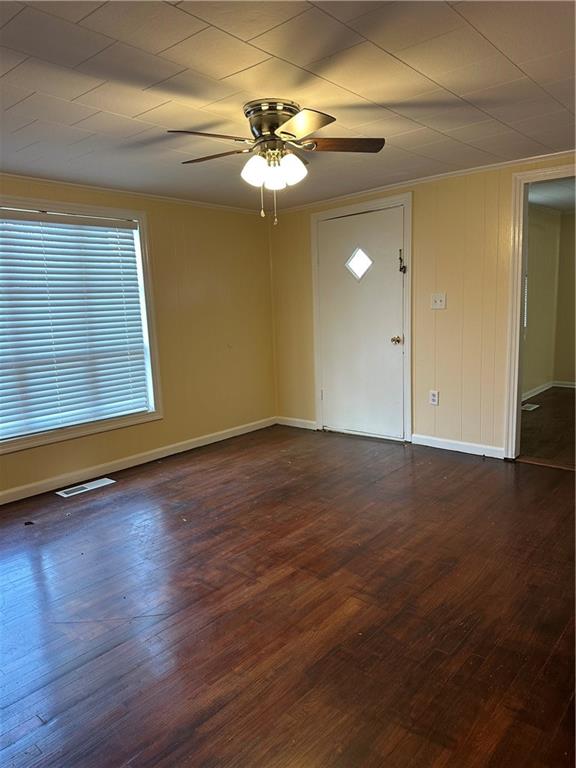 615 Cassville Road Southeast, Unit A Cartersville, GA 30120 - Photo 9 of 21 an empty room with wooden floor fan and windows