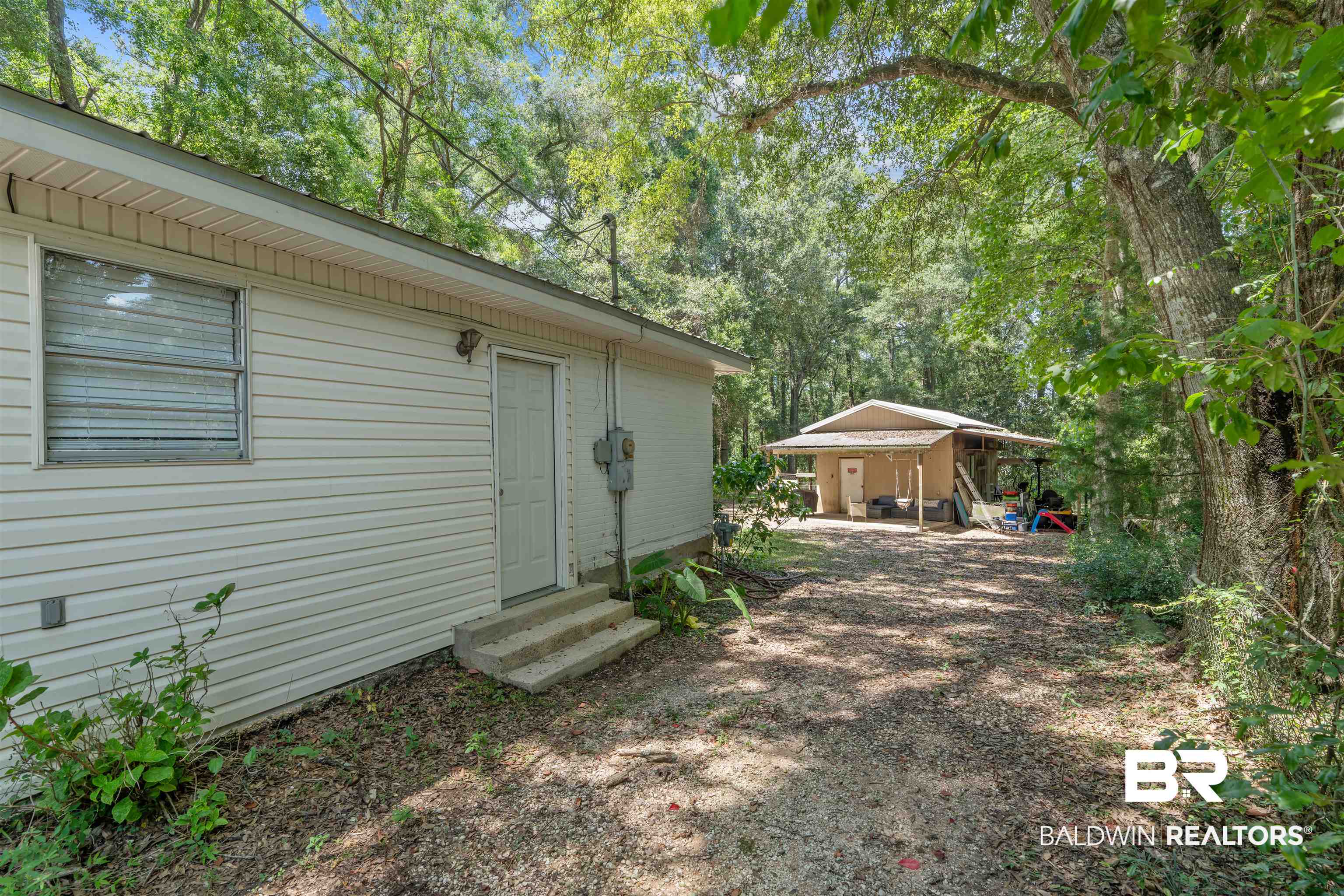 922 Dauphine Circle Daphne, AL 36526 - Photo 14 of 29 View of yard featuring entry steps and a carport