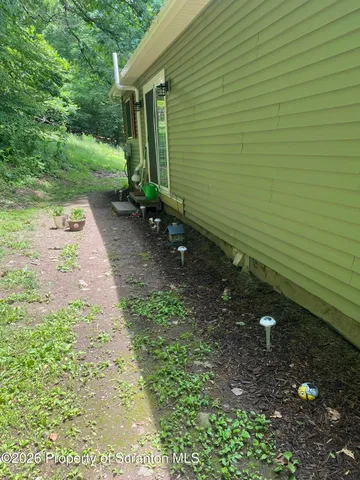 a living room with furniture fireplace and a large window