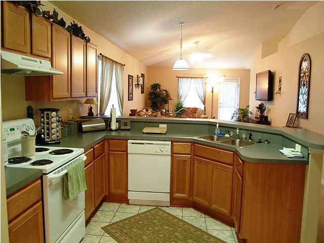105 Bayou Landing Road Miramar Beach, FL 32550 - Photo 2 of 15 a kitchen with a sink stove and cabinets