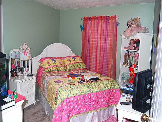 105 Bayou Landing Road Miramar Beach, FL 32550 - Photo 11 of 15 a bedroom with a bed and cabinets