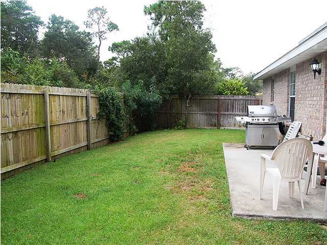 105 Bayou Landing Road Miramar Beach, FL 32550 - Photo 14 of 15 a view of backyard with a garden and deck