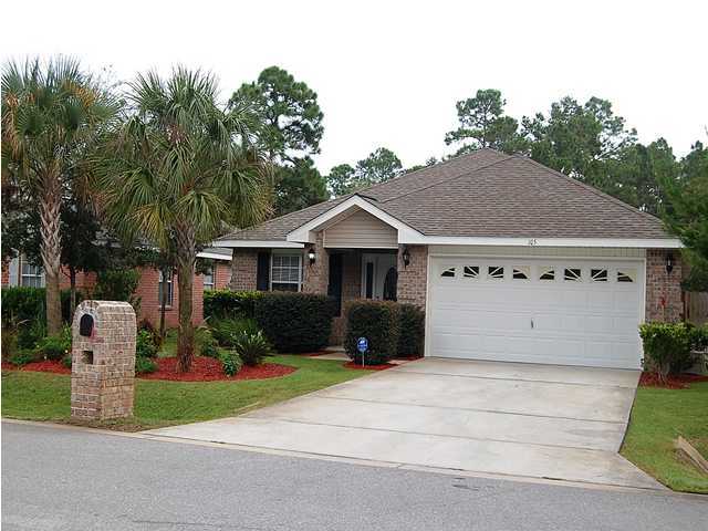 105 Bayou Landing Road Miramar Beach, FL 32550 - Photo 15 of 15 a front view of a house with a garden and garage