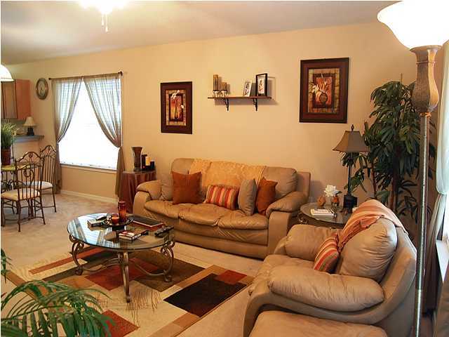 105 Bayou Landing Road Miramar Beach, FL 32550 - Photo 3 of 15 a living room with furniture a couch and a potted plant