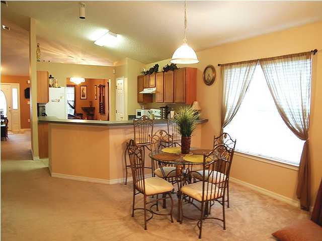 105 Bayou Landing Road Miramar Beach, FL 32550 - Photo 5 of 15 a view of a dining room with furniture window and wooden floor