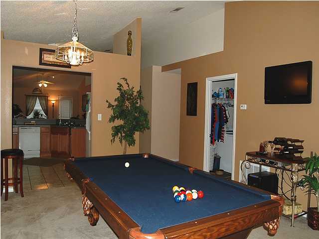 105 Bayou Landing Road Miramar Beach, FL 32550 - Photo 7 of 15 a living room with furniture pool table and a flat screen tv