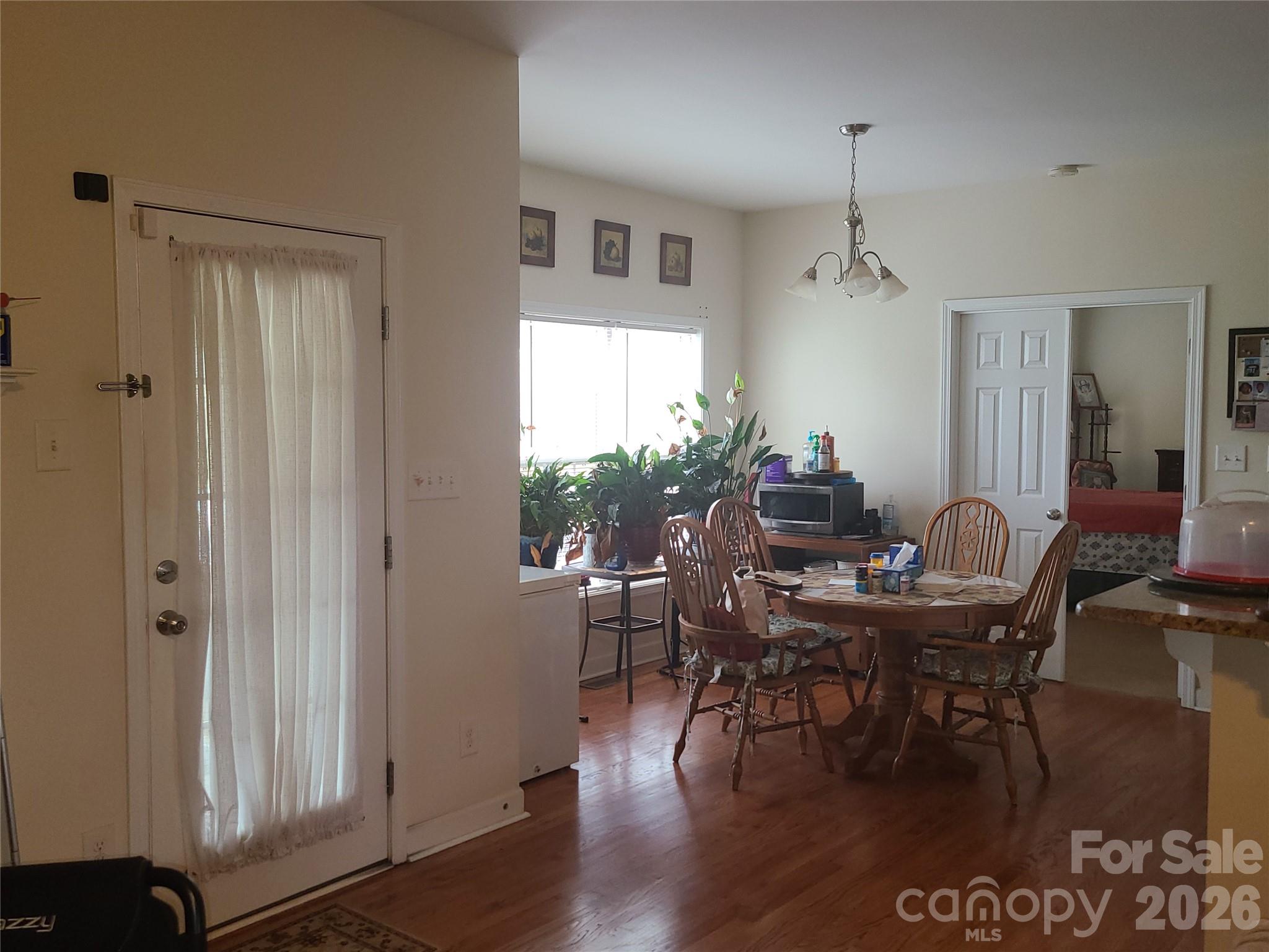1638 Bess Town Road Bessemer City, NC 28016 - Photo 13 of 31 a view of a dining room with furniture window and wooden floor