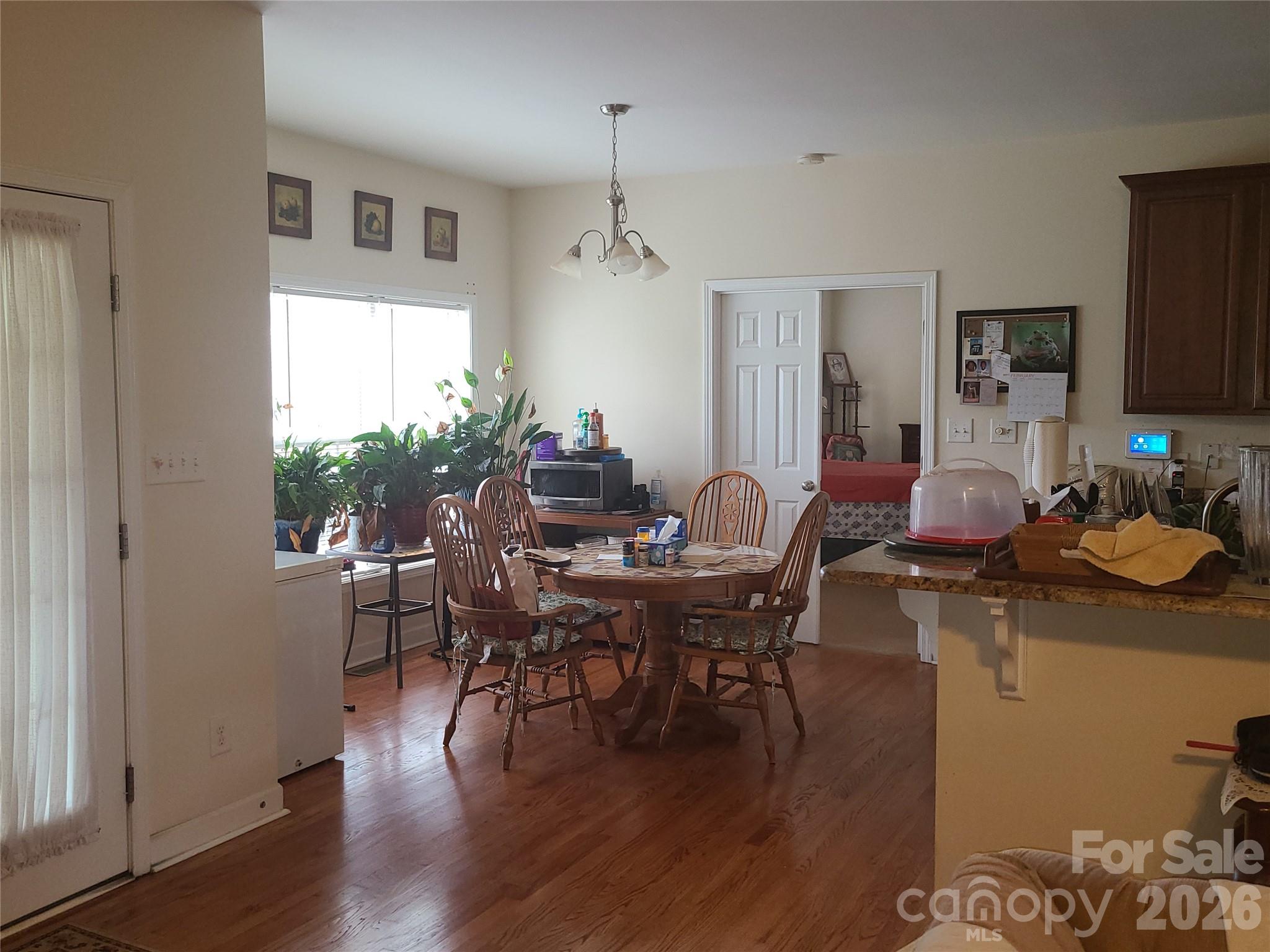 1638 Bess Town Road Bessemer City, NC 28016 - Photo 14 of 31 a view of a dining room with furniture window and wooden floor