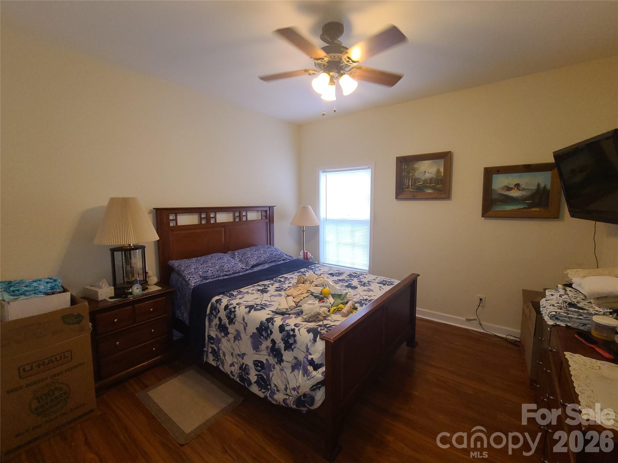 1638 Bess Town Road Bessemer City, NC 28016 - Photo 18 of 31 a bedroom with a bed and a tv on the dresser