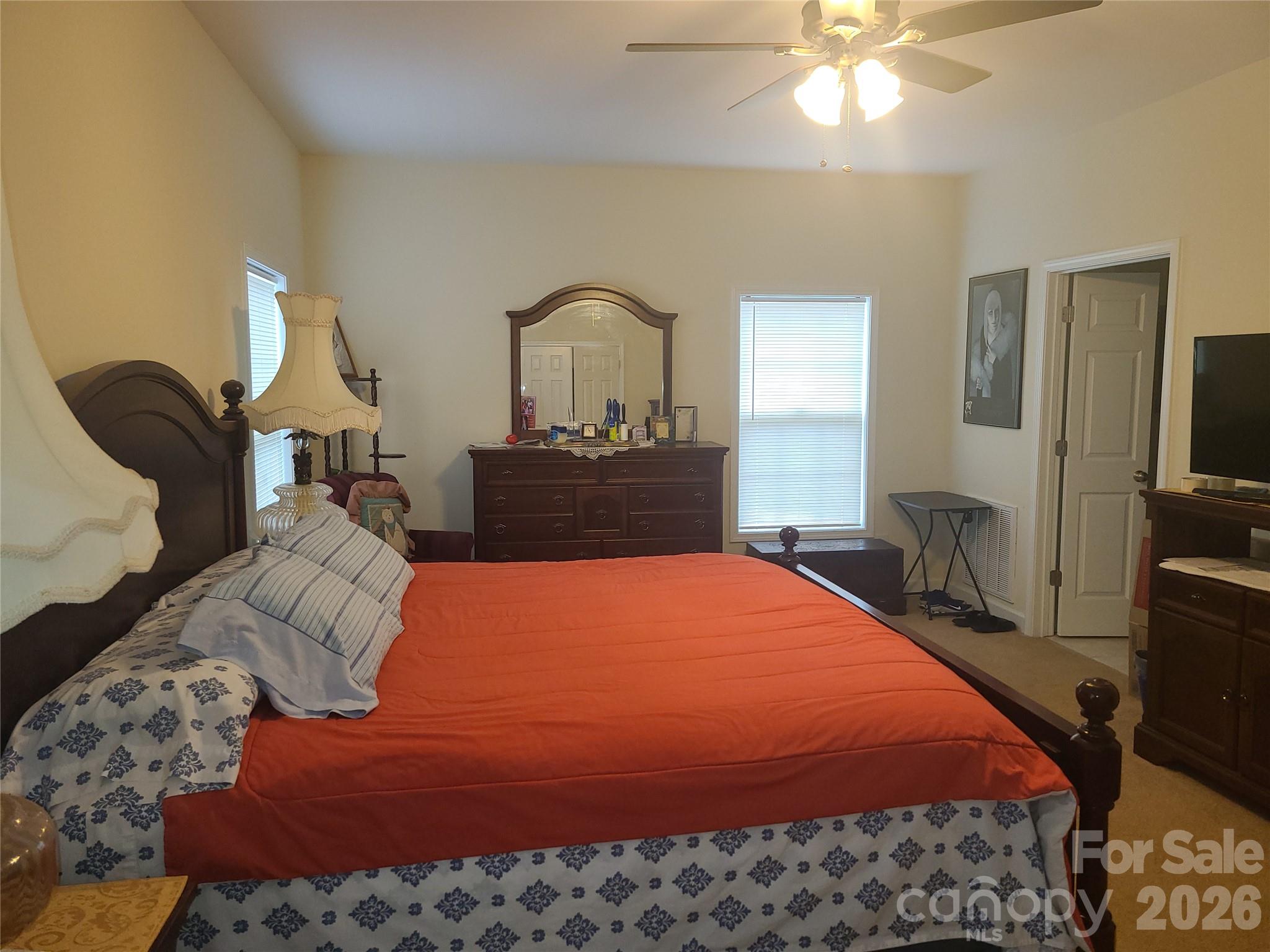 1638 Bess Town Road Bessemer City, NC 28016 - Photo 22 of 31 a bedroom with a bed and a chandelier