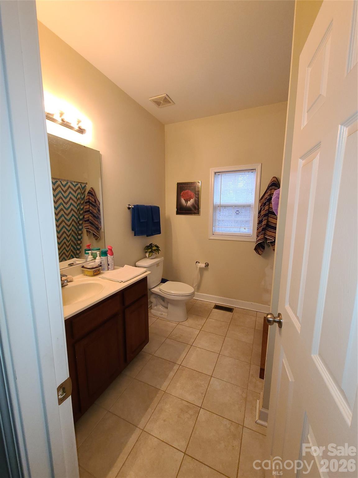 1638 Bess Town Road Bessemer City, NC 28016 - Photo 23 of 31 a bathroom with a sink mirror vanity and toilet