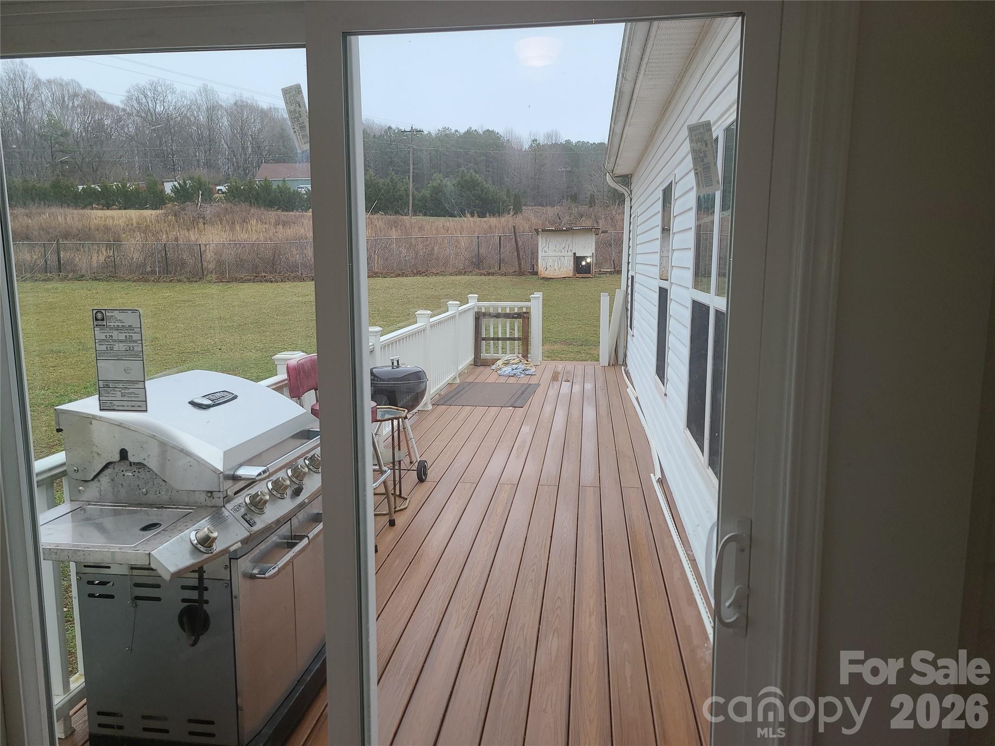 1638 Bess Town Road Bessemer City, NC 28016 - Photo 6 of 31 a view of a hardwood floor and a kitchen view