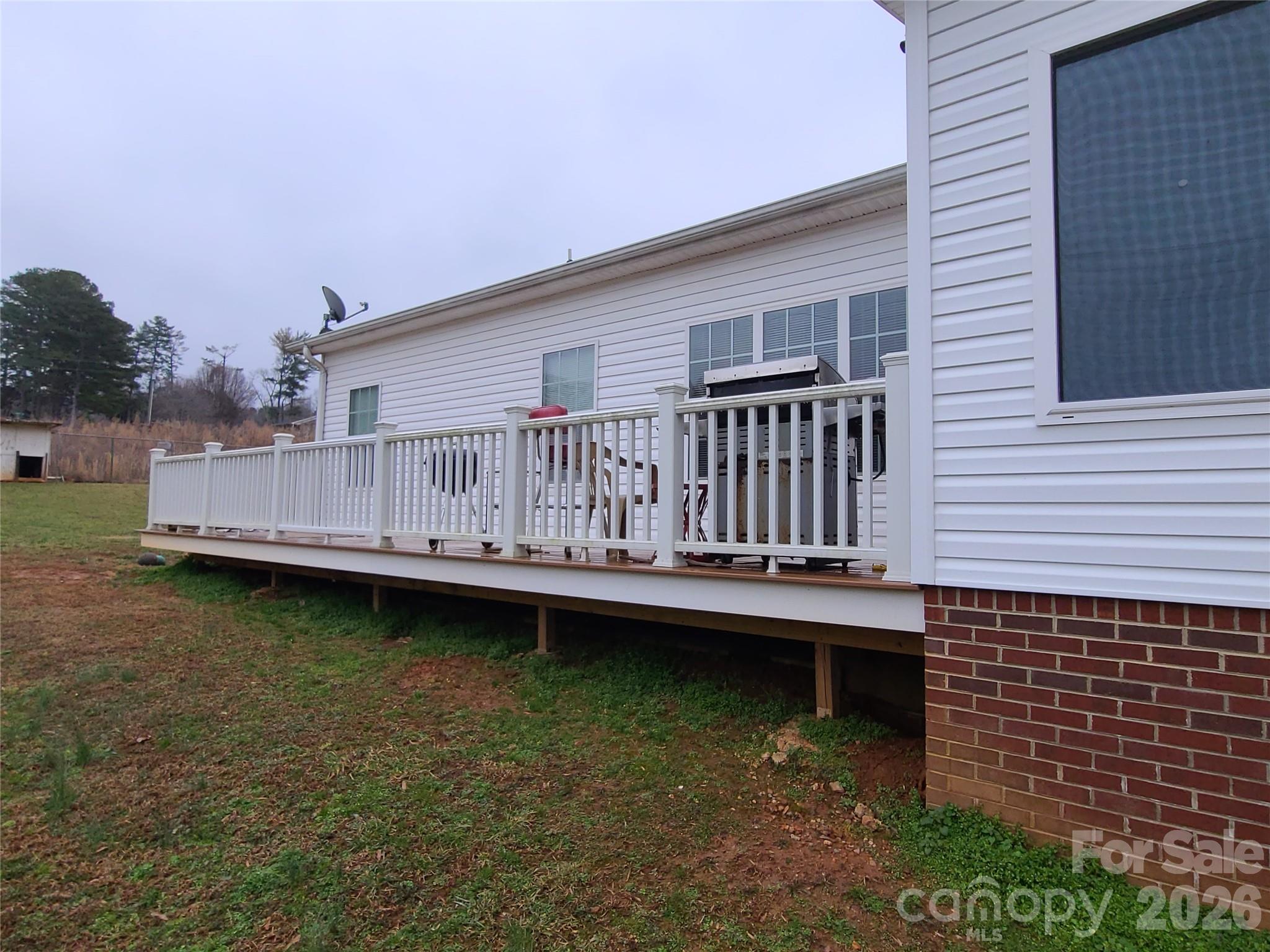 1638 Bess Town Road Bessemer City, NC 28016 - Photo 7 of 31 a view of a house with wooden deck and a yard