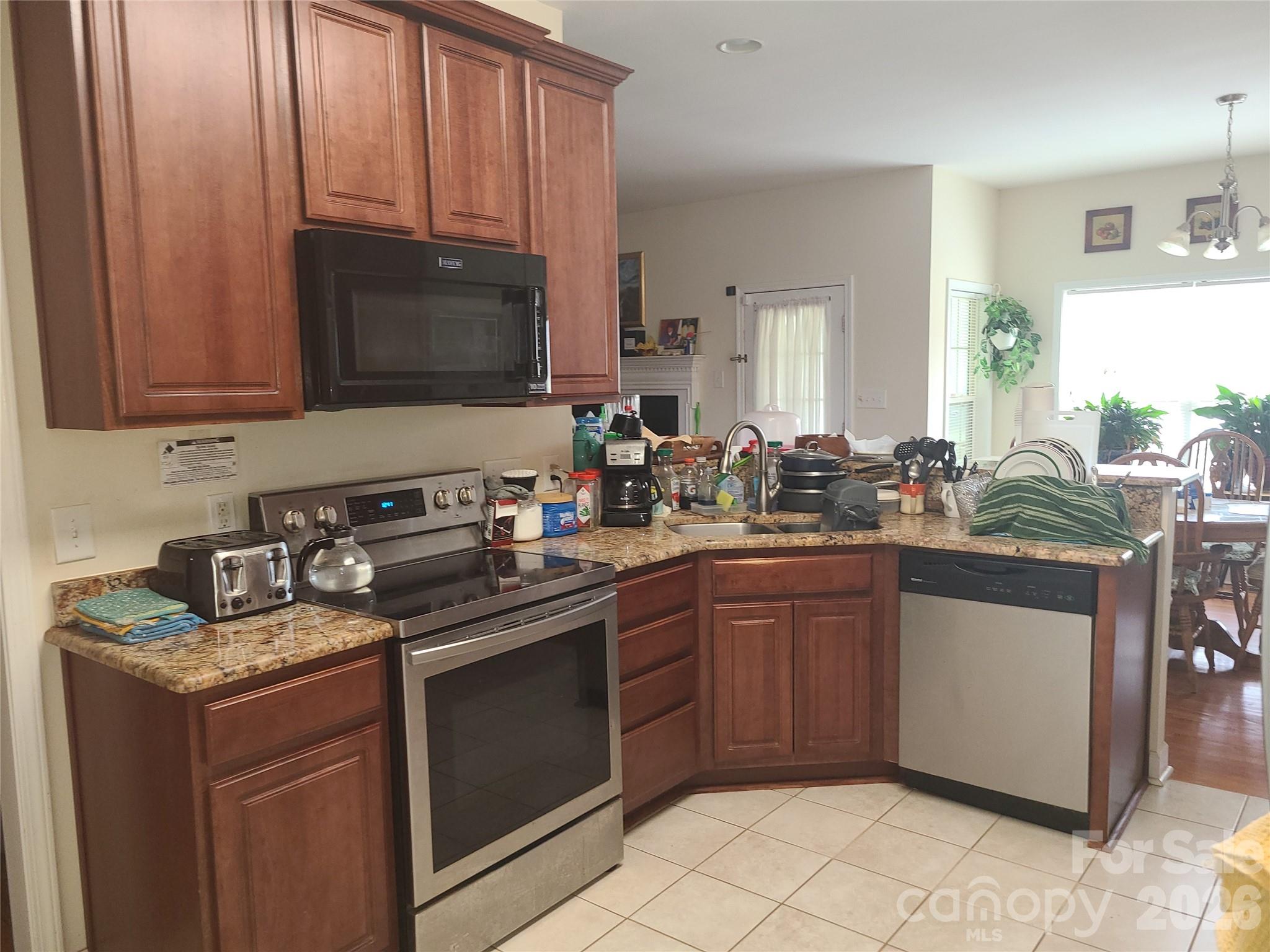 1638 Bess Town Road Bessemer City, NC 28016 - Photo 10 of 31 a kitchen with a sink stove and microwave