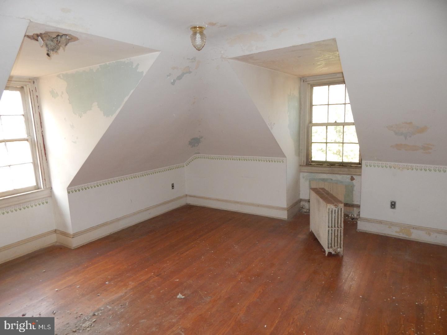 605 Upland Road Pikesville, MD 21208 - Photo 11 of 38 a view of an empty room with a window
