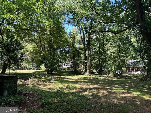605 Upland Road Pikesville, MD 21208 - Photo 23 of 38 a view of outdoor space with deck and yard