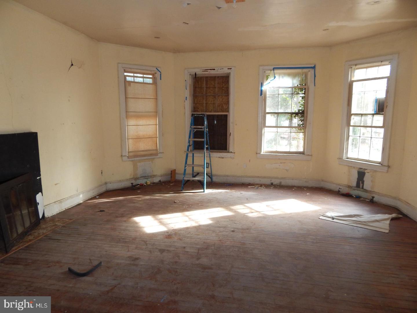 605 Upland Road Pikesville, MD 21208 - Photo 5 of 38 an empty room with windows