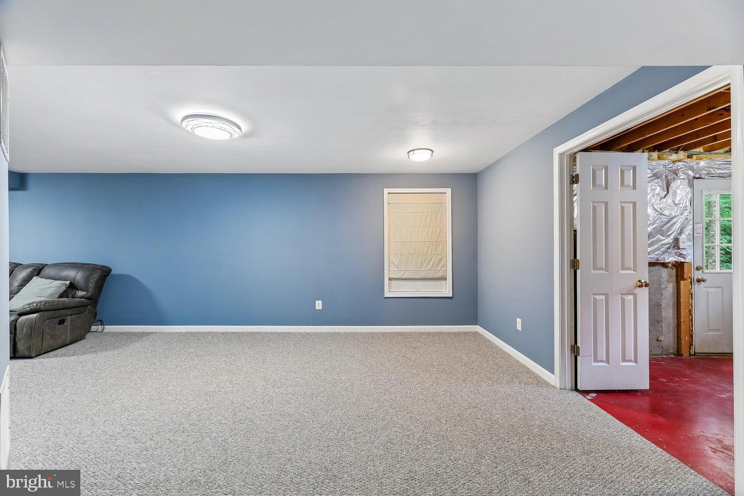 3707 Turn Back Trail Triangle, VA 22172 - Photo 47 of 55 a view of an empty room with wooden floor and a window