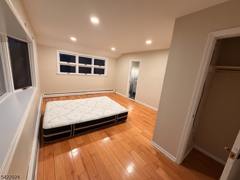 62 Gaston Road, Unit 62 Morristown, NJ 07960 - Photo 24 of 42 a large room with wooden floor