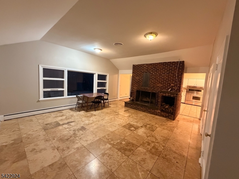 62 Gaston Road, Unit 62 Morristown, NJ 07960 - Photo 27 of 42 a view of a livingroom with a fireplace and a window