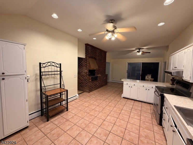 62 Gaston Road, Unit 62 Morristown, NJ 07960 - Photo 30 of 42 a view of kitchen with cabinets and refrigerator
