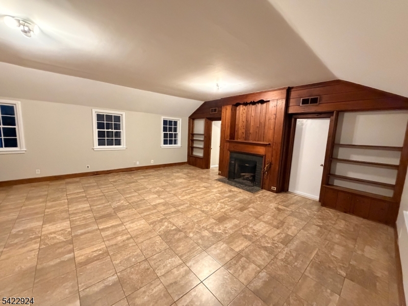 62 Gaston Road, Unit 62 Morristown, NJ 07960 - Photo 33 of 42 a view of an empty room with a fireplace